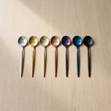 Istanbul Teaspoon — jewel-toned teaspoons on a warm wood table