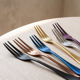 Close-up of the Milan Fruit Fork iridescent finishes