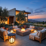 Flower Pot Lamps used as glowing side tables around a hillside fire pit at dusk
