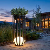 Close-up of the Flower Pot Lamp slatted cage, planter bowl and illuminated globe