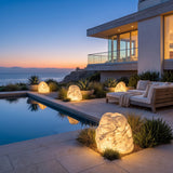 Garden Stone Outdoor Lights lining a poolside terrace at dusk