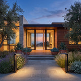 A matched pair of LaVie Solar Lights lighting a front entrance at dusk