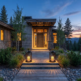 A matched pair of Lantern Sora Weave lanterns lighting a front entrance at dusk