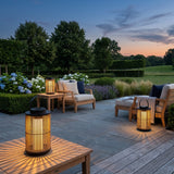 Lantern Sora Weave lanterns on a terrace lounge setting at dusk