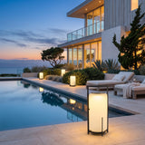 Lampara Outdoor Light (Solar) lining a poolside terrace at dusk