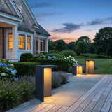 Block Lane Outdoor Solar Light glowing on a luxury estate terrace at dusk