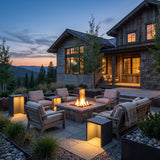 Block Lane Outdoor Solar Light around an outdoor fire pit seating area at dusk