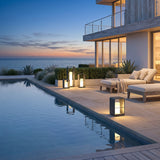 Garden Lantern (Solar) lining a poolside terrace at dusk