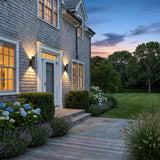 A matched pair of Sunset Wall Light flanking a front door at dusk
