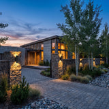 Sunset Wall Light mounted on masonry gate piers at dusk