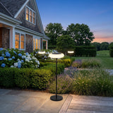 Signature Outdoor Solar Lamp glowing on a luxury estate terrace at dusk