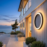 A run of Eclipse Glow Outdoor Light along a house facade at dusk