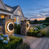 Eclipse Glow Outdoor Light mounted on masonry gate piers at dusk