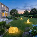Vibrant Stone Outdoor Light spread across an estate lawn at dusk