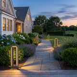 Prism Pathway Light (Outdoor Solar) lighting a stone garden path at dusk