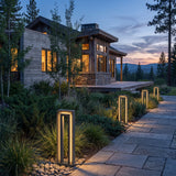 Prism Pathway Light (Outdoor Solar) set among garden planting at dusk