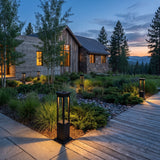Nimbus Quad Solar Light set among garden planting at dusk