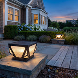 Glow Beam Outdoor Light (Solar) glowing among garden planting at dusk