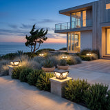 Glow Beam Outdoor Light (Solar) set among garden planting at dusk