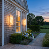 Marble Outdoor Wall Light mounted on an exterior wall, washing the surface with warm light at dusk