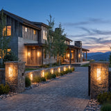 Marble Outdoor Wall Light mounted on masonry gate piers at dusk