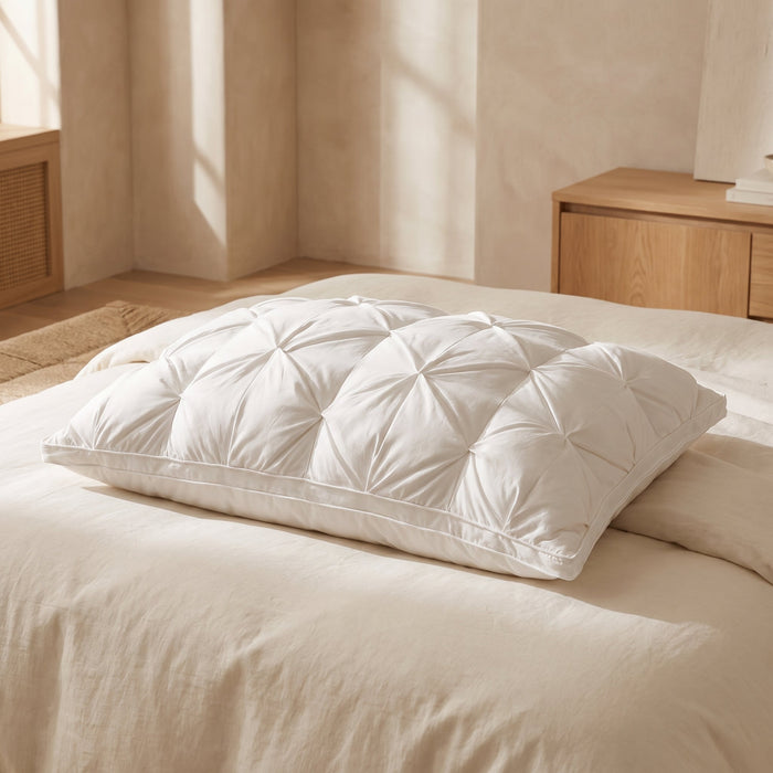 Premium goose down pillow, rectangular with piped border, on a cream bed