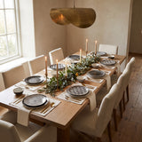 Euclid Plate Collection styled in a warm dining room