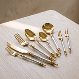 Close-up of the Noble Golden Cutlery Set gold heads and baroque handles