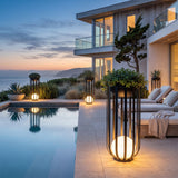 Flower Pot Lamps lining an oceanfront poolside terrace at dusk