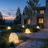 Garden Stone Outdoor Lights set among garden planting at dusk