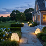 Garden Stone Outdoor Lights lighting a stone garden path at dusk