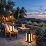 Contemporary Lamp lanterns moved around an outdoor lounge setting at dusk