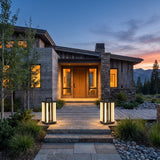 A matched pair of Contemporary Lamp lanterns lighting a front entrance at dusk