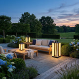 Contemporary Lamp lanterns on a terrace lounge setting at dusk