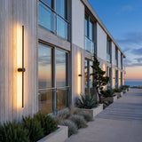 A run of Luminous Line Outdoor Lights along a house facade at dusk