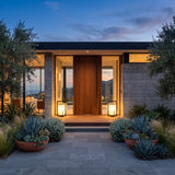 A matched pair of Lampara Outdoor Light (Solar) lighting a front entrance at dusk
