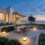 Lampara Outdoor Light (Solar) lighting an outdoor dining terrace at dusk