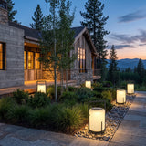 Lampara Outdoor Light (Solar) set among garden planting at dusk