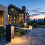 Block Lane Outdoor Solar Light glowing on a luxury estate terrace at dusk