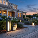 Garden Lantern (Solar) glowing among garden planting at dusk