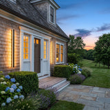 A matched pair of Outdoor Sleek Wall Light flanking a front door at dusk