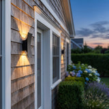 Sunset Wall Light mounted on an exterior wall at dusk, shown close