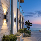 A run of Sunset Wall Light along a house facade at dusk