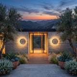 A matched pair of Eclipse Glow Outdoor Light flanking a front door at dusk