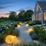 Vibrant Stone Outdoor Light lighting a stone garden path at dusk