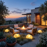 Vibrant Stone Outdoor Light around an outdoor fire pit seating area at dusk