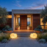 A matched pair of Vibrant Stone Outdoor Light lighting a front entrance at dusk