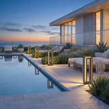 Prism Pathway Light (Outdoor Solar) lining a poolside terrace at dusk