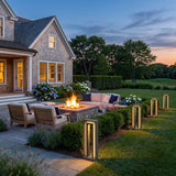 Prism Pathway Light (Outdoor Solar) around an outdoor fire pit seating area at dusk