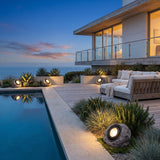 Rocky Light (Outdoor Solar) lining a poolside terrace at dusk